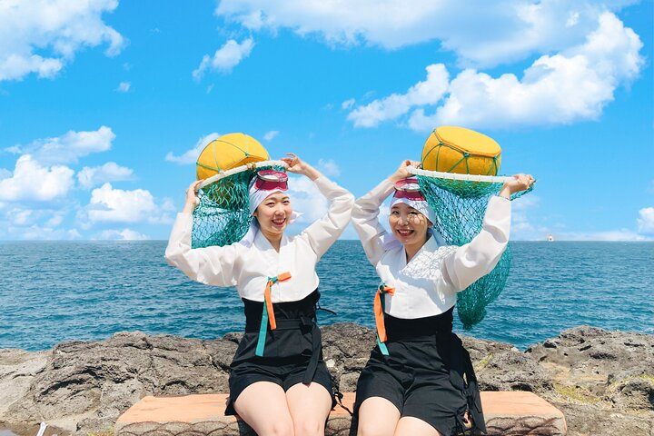 Experience the charm of Jeju with traditional Haenyeo attire complemented by stunning coastal views. Dive into local culture while capturing unforgettable memories through professional photography.